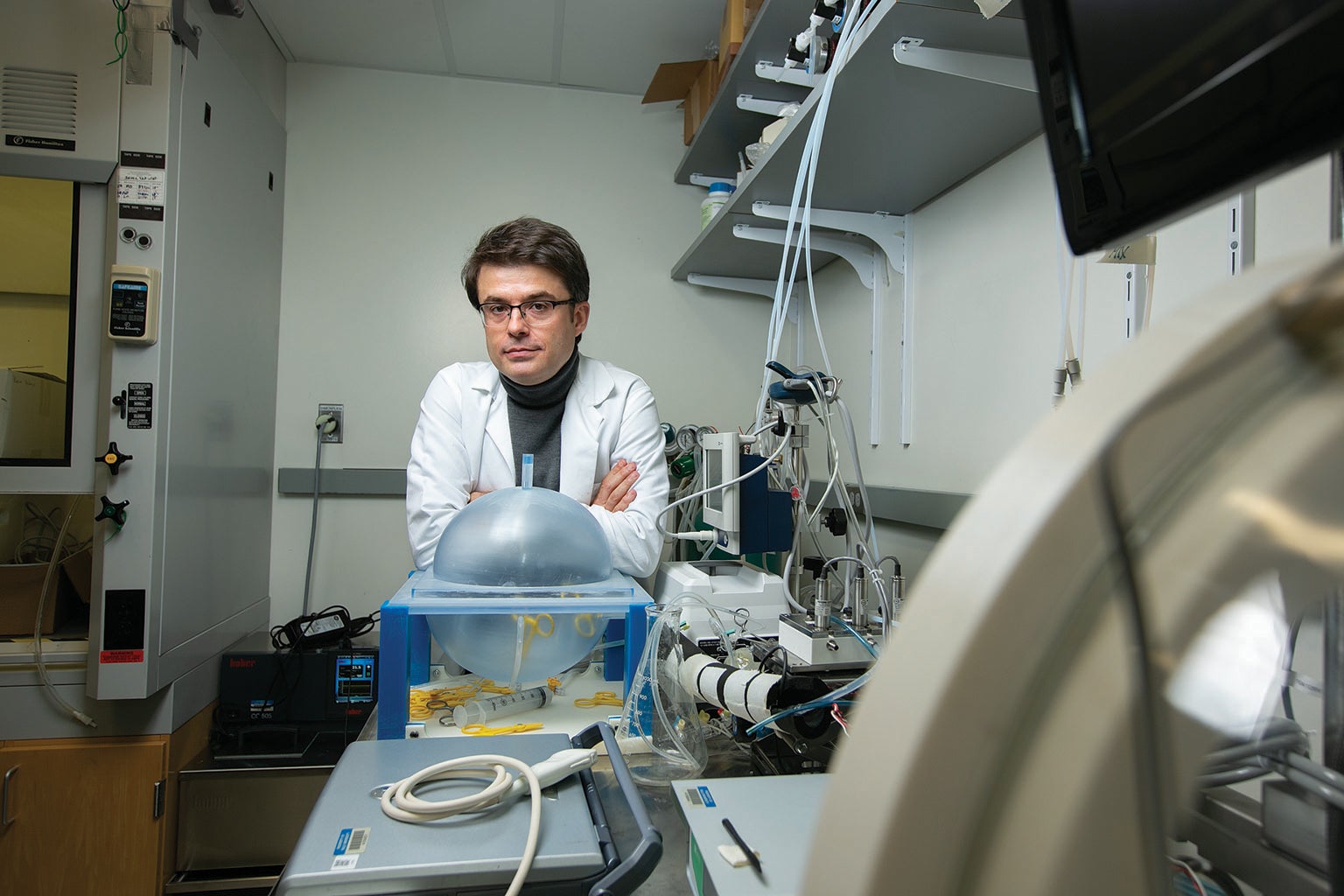 Neuroscientist Nenad Sestan in a lab staring at camera with his arms crossed.