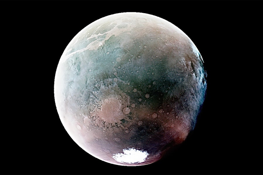 A view of MARS captured in ultraviolet light, resulting in the appearance of a blue colored tint along the equator of the planet, gradating to a red/purple-ish tint towards the Southern pole