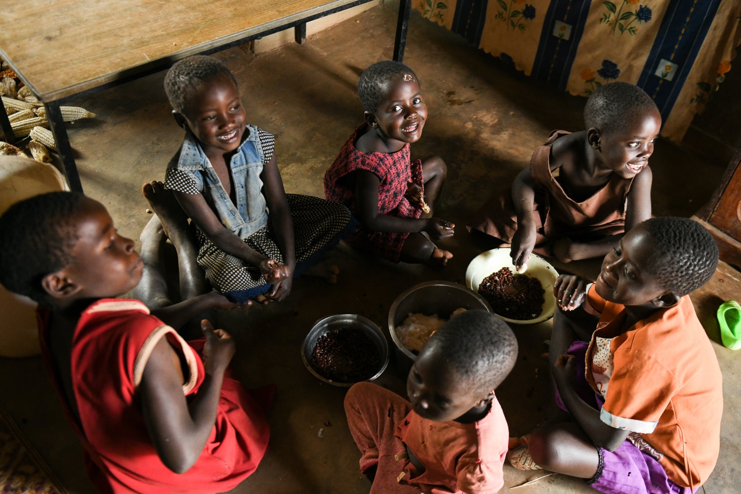 A group of children learn how to cook.