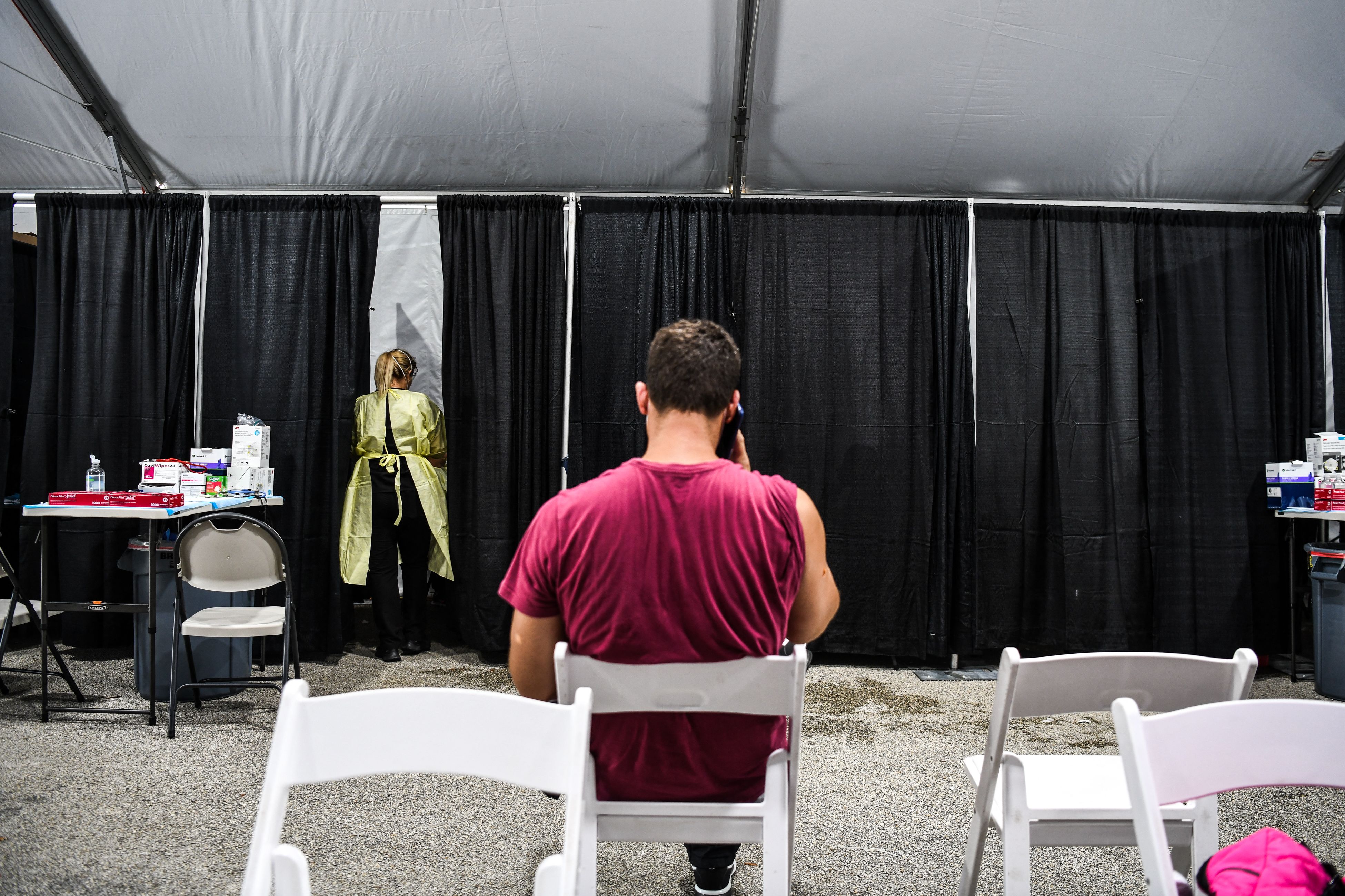 A patient waits for his treatment inside a monoclonal antibody treatment site in Pembroke Pines, Fla., on August 19, 2021. 