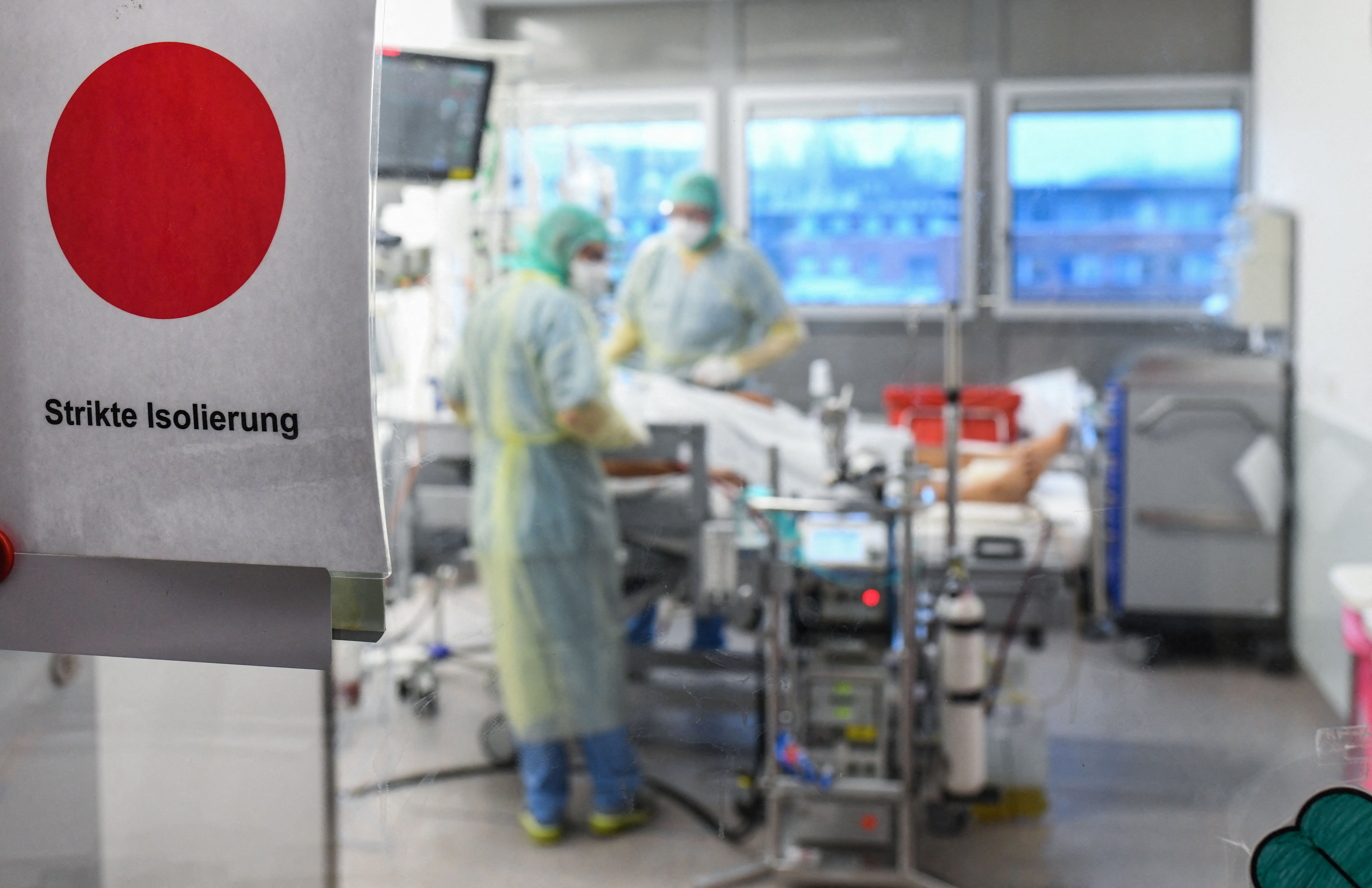 A sign reading 'strict isolation' is seen on the window of an intensive care Unit with Covid-19 coronavirus patient.