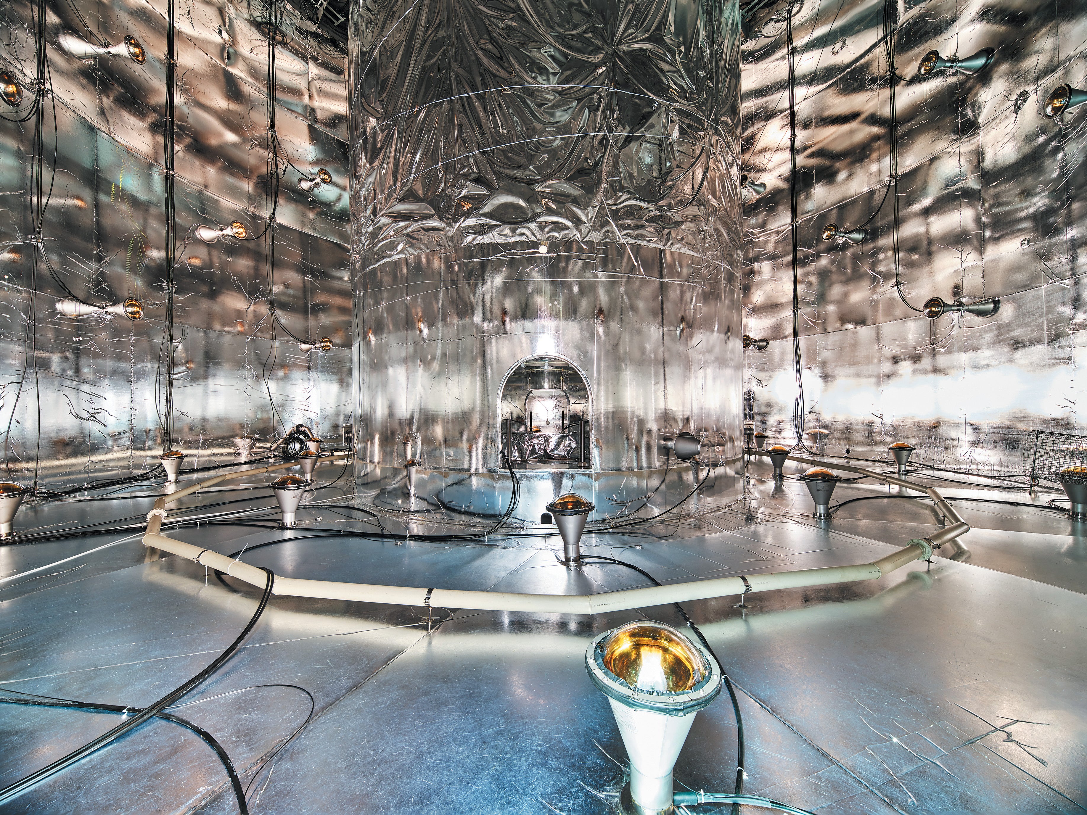 Inside the LEGEND-200 water tank, mirror film surrounds the liquid-argon cryostat.