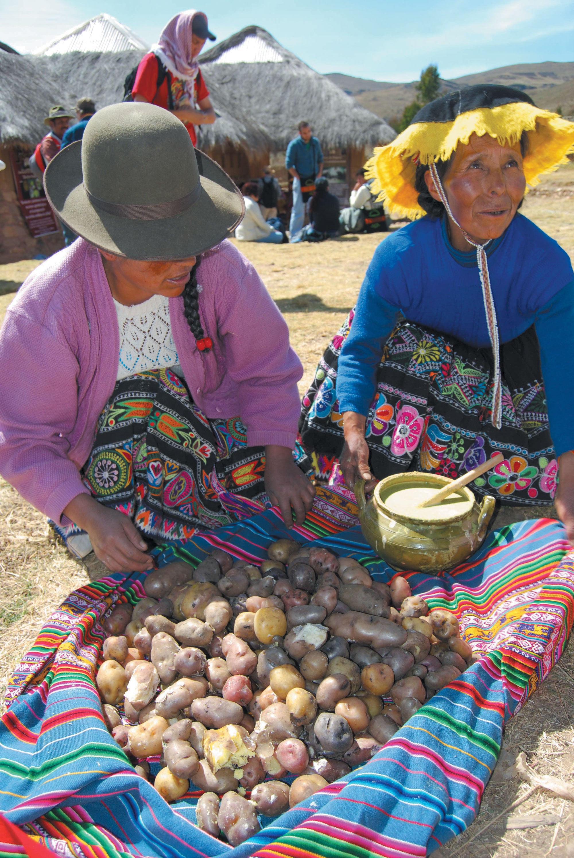 Quechua indigenous women selling potatoes.