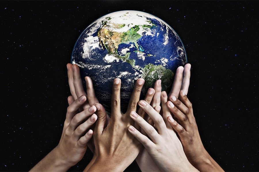 Hands holding up the Earth