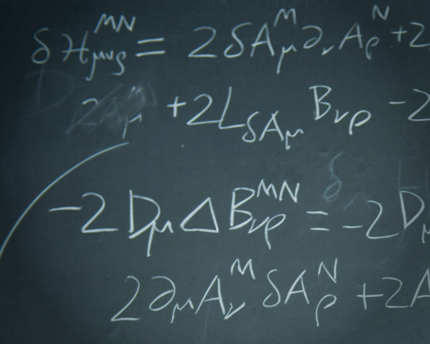 Chalkboard image showing complex equations