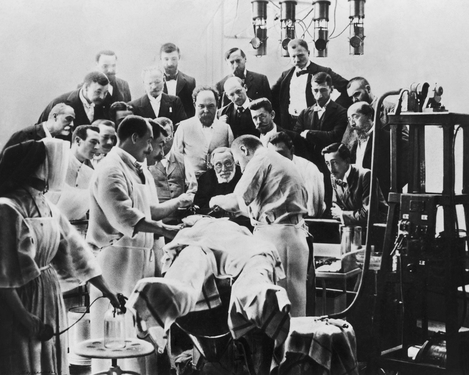 Rudolf Virchow, the famous German pathologist and anthropologist, observing a cerebral operation in the Sorbonne in Paris, August 1900.