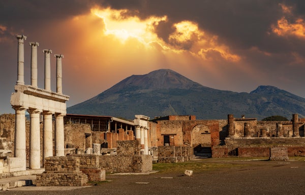 A view of the columns around the Forum of Pompeii, with Mt Vesuvius shown in the background.