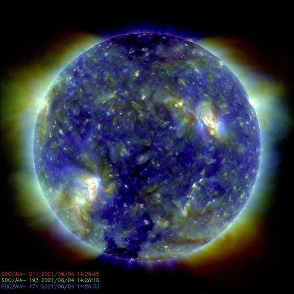 A false-color image of thesun in greens and blues.