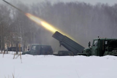 Missile being fired in a snowy, barren landscape.