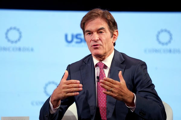 Dr. Oz gestures while speaking on stage in New York City.