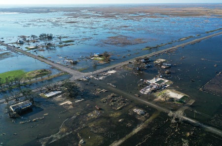 An aerial view of flood waters from Hurricane Delta surrounding structures destroyed by Hurricane Laura on October 10, 2020 in Creole, Louisiana.