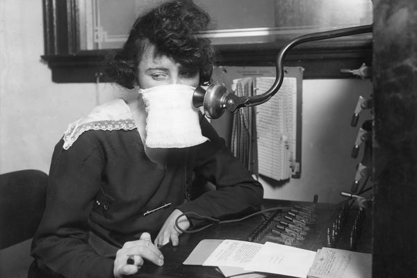 A telephone operator wears protective gauze during 1918's flu pandemic