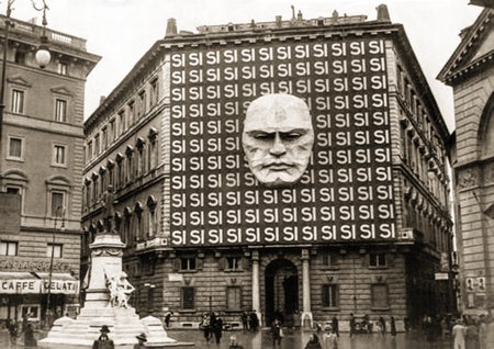 Archival photo showing Mussolini's face on facade of building