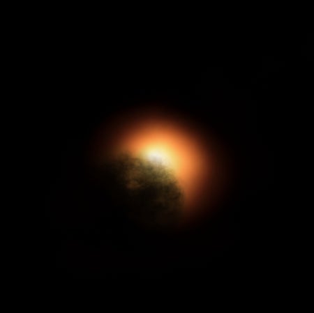 Partially obscured star.