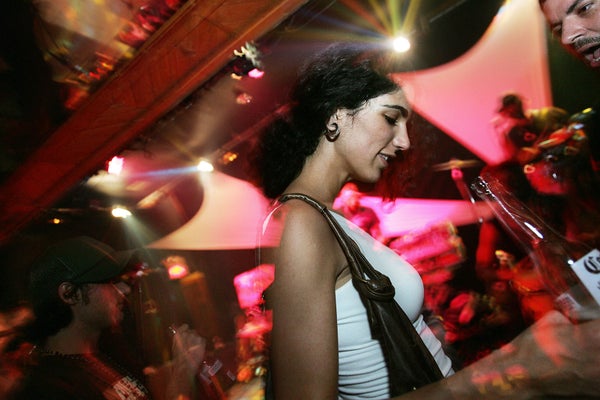 Cuban-American woman dancing in a nightclub in Miami.