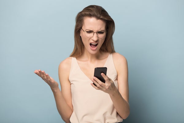 Angry woman using phone