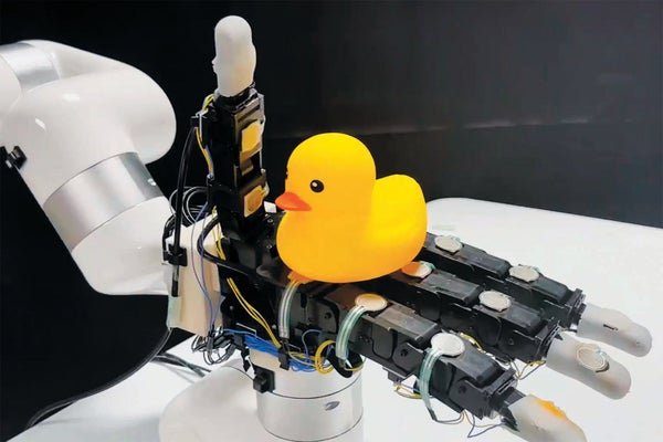 A rubber duck sitting upon robotic sensors.