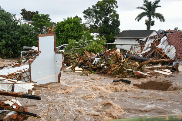 Flood waters and a destroyed house.