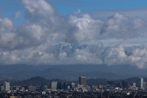 Clouds hover in the background of downtown Los Angeles skyline