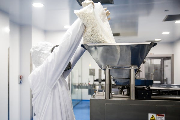 A lab technician works on the production of molnupiravir, an oral antiviral drug that some countries have authorized for use against COVID-19.