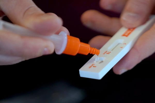 Close-up of prepping at-home COVID-19 test.