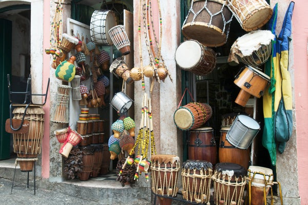 Brazilian drums and African musical instruments on display at a market