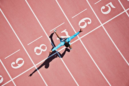 runner crossing finish line