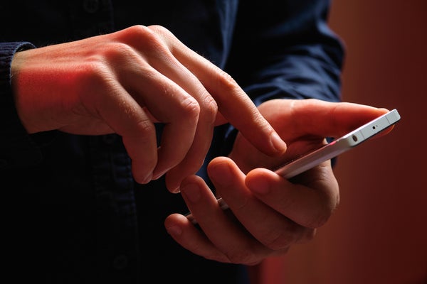 A person holds a smartphone in their hands