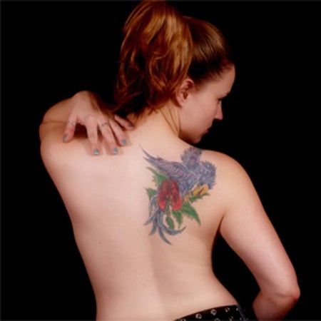 tatoo on woman's back shoulder