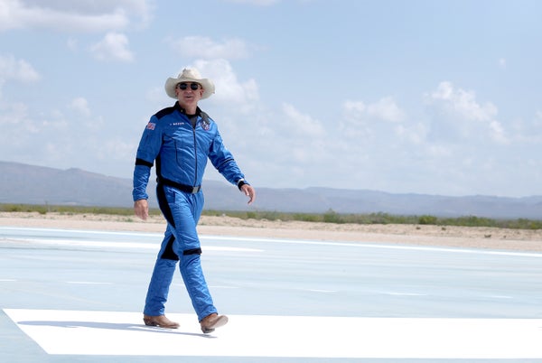 Jeff Bezos in his blue spacesuit and cowboy hat.