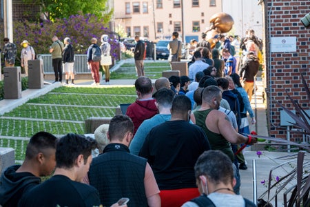 Residents wait in line outside Zuckerberg San Francisco General Hospital And Trauma Center.