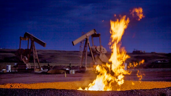Flames from a flaring pit near a well in the Bakken Oil Field.