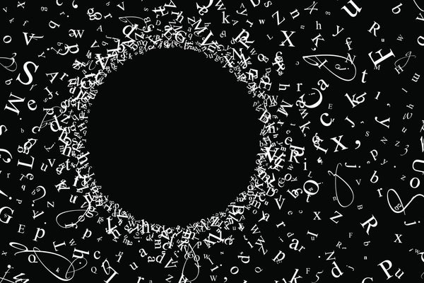 alphabet and numeric symbols on black background in shape of a black hole