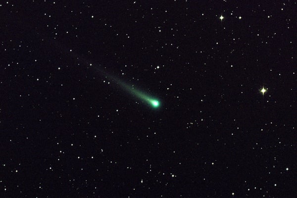 Green comet flying hurtling thru space