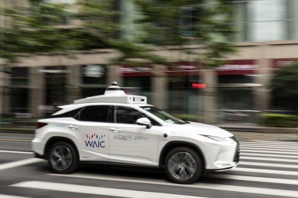 A self-driving car from the autonomous vehicle company Pony.ai drives along a road in Shanghai, China, this past summer.