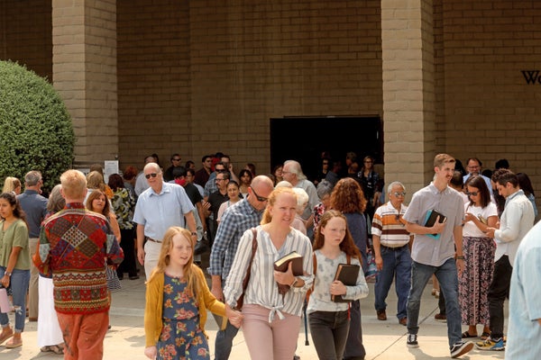 People exit a California church in September, 2020, after defying a court's order not to hold indoor services.