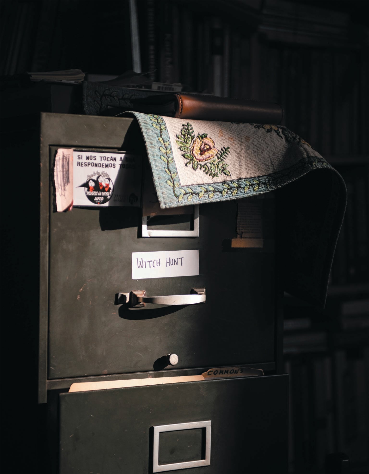 A filing cabinet with the words ‘witch hunt’ labeled on one of the drawers.