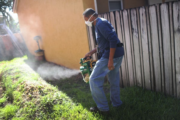man spraying for mosquitoes