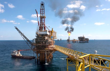 Oil rig and methane flame.