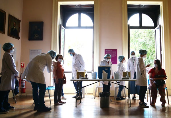 Public health workers vaccinate people at a COVID-19 vaccination clinic at Museu da Republica (Museum of the Republic) on May 24, 2021 in Rio de Janeiro, Brazil.