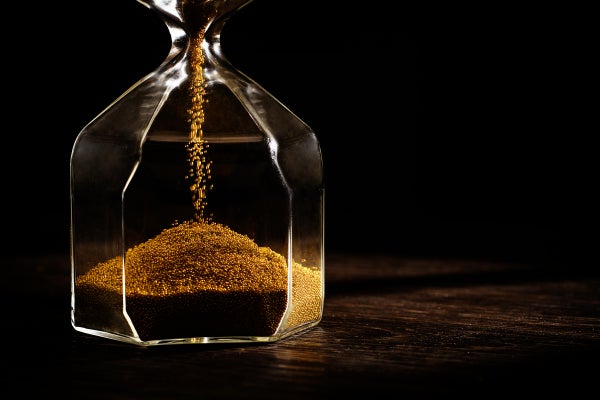 Sands flow in an hourglass.