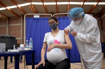 Pregnant person getting vaccine