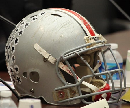 image of a football helmet with many scratches on it