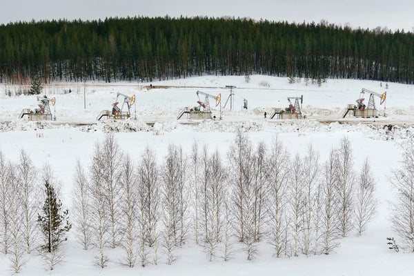 Oil rigs in a snowy landscape