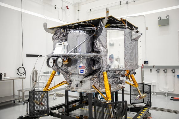 Teams with Astrobotic install the NASA meatball decal on Astrobotic's Peregrine lunar lander on Tuesday, Nov. 14, 2023, at the Astrotech Space Operations Facility near the agency's Kennedy Space Center in Florida.