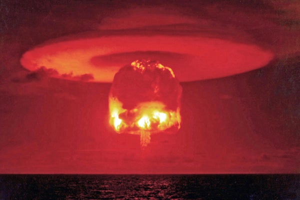 Deep red skies with nuclear bomb explosion over ocean