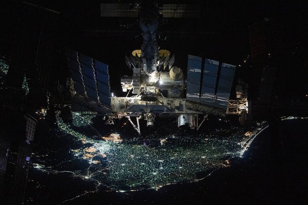 A view of the space station with the Earth's Nile Delta in the background.