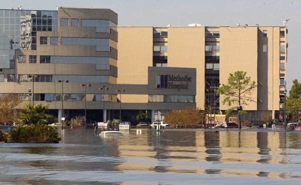 A hospital stands partially submerged in flood waters in New Orleans