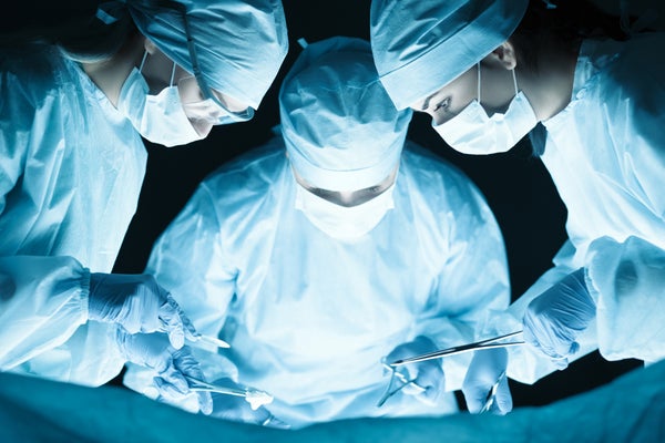 surgeons at operating table