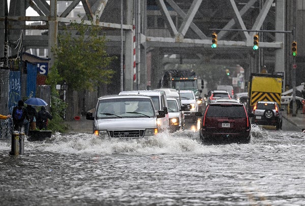 Flooded NYC road with cars